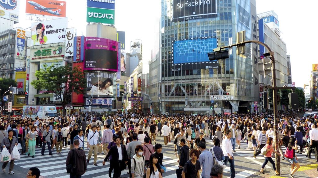 crowds of people walking in downtown toyko
